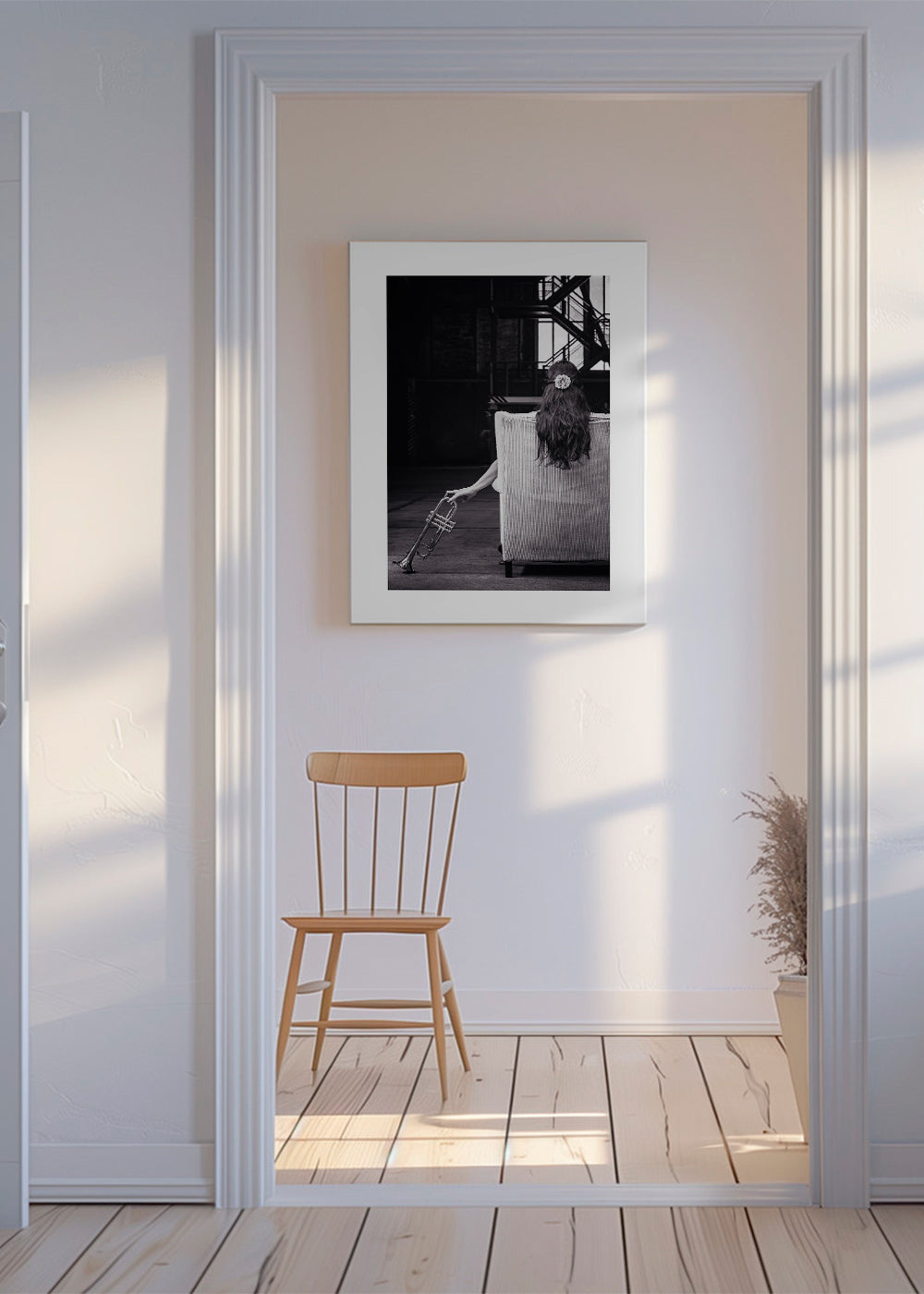 Fotografie hudebníka vsedě zezadu s trumpetou