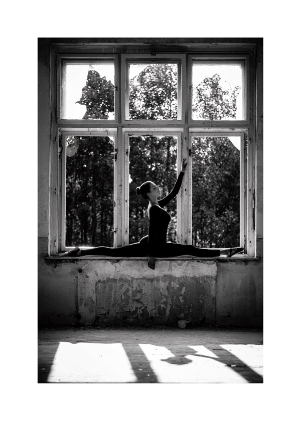 Fotografie baletky v okně