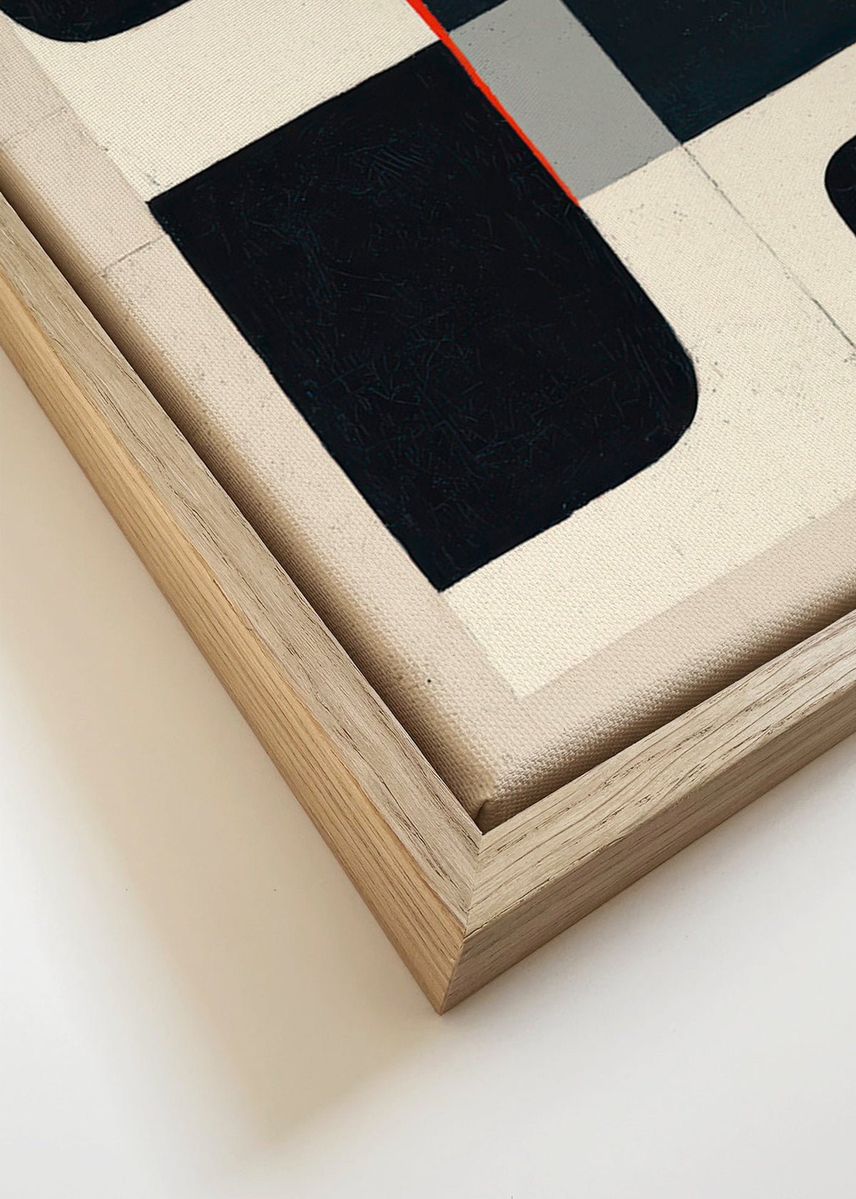 Geometrický obraz s černými bloky a červeným akcentem – Canvas detail